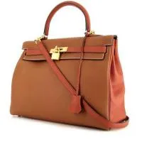 Сумка Hermes Kelly высотой 35 см из двухцветной кожи тогого кирпично-красного и золотого цветов.