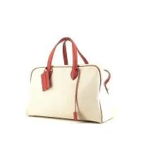 Дорожная сумка Hermès Victoria - Дорожная сумка из красной кожи и бежевого холста.