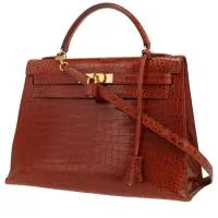 Сумка Hermès Kelly 32 см коньячного цвета с пористым крокодилом