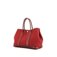 Сумка-шоппер Hermès Garden из канвы H красного цвета и кожи гранатово-красного цвета.
